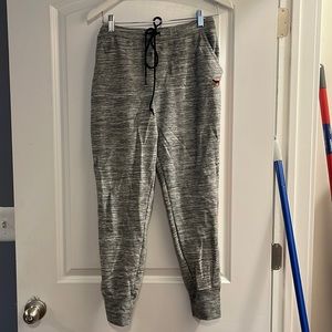 Pink by Victoria’s Secret large gray white orange stripe down the side joggers